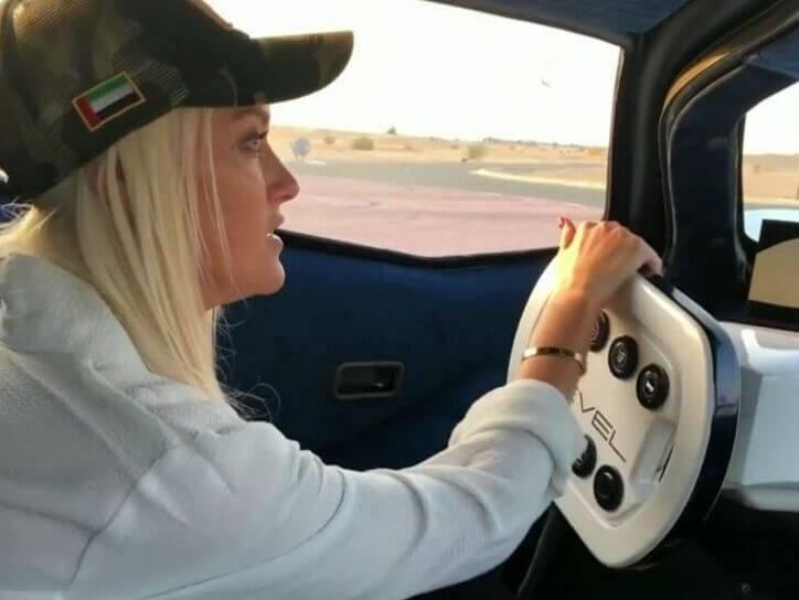 Supercar blondie driving Devel Sixteen 