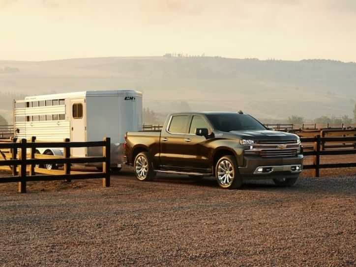 Chevy Silverado 1500 parked with a trailer